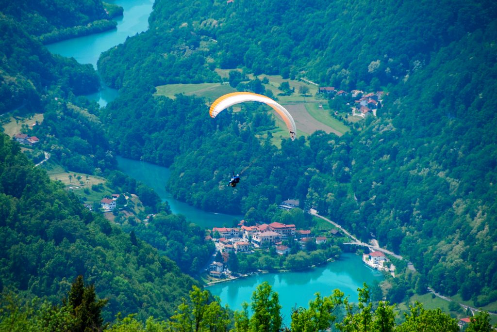 Adventurous paragliding activity near Premium Hostel Kobarid, offering breathtaking views