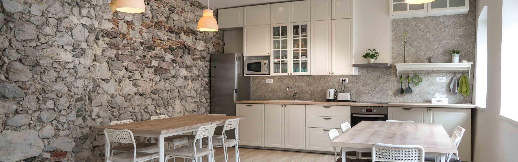 Interior view of Hostel Kobarid, a charming historical building with alpine terraced gardens in the heart of Soca Valley.